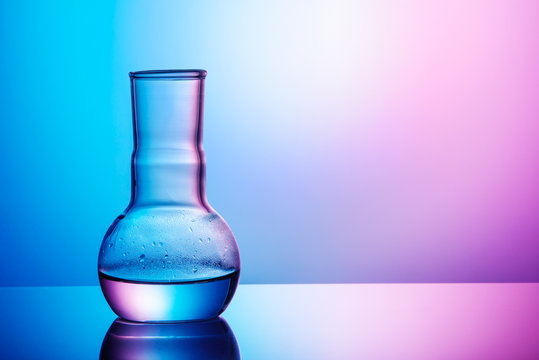 chemical flask with water, with gradients of warm and cold colors