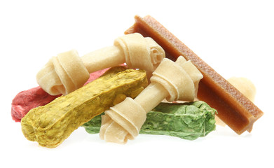 bones and colorful sticks for dog treat with vitamin and oral health on white background