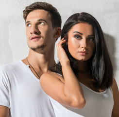 Happy loving couple posing together on sunny day