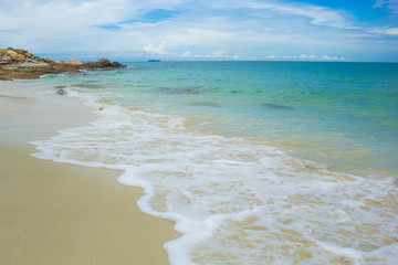 Soft Wave Of Blue Ocean On Sandy Beach