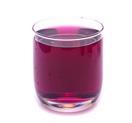Glass of red grape juice with fruit isolated on white