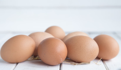 Eggs chicken on white wood background