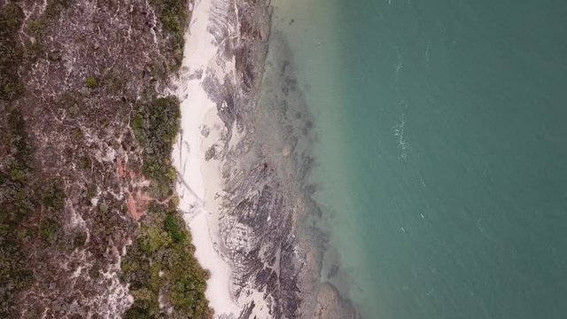 4K summer day aerial camera down video of stony sandy beach located at Breede River estuary in holiday seaside fishermen small town Witsand (White Sand) in Garden Route, Western Cape, South Africa