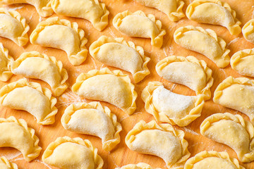 Beautiful delicious dumplings on a wooden Board, cooked at home.