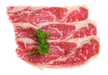 Fresh raw beef meat slices isolated over white background