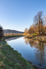 Fototapeta na wymiar Looking along the River Ouse near Lewes in Sussex, on a sunny winters day