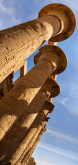 Karnak Temple, complex of Amun-Re. Embossed hieroglyphics on columns. The large courtyard of the...