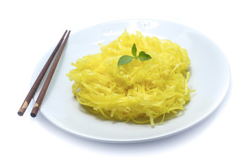 yellow noodles on dish isolated on white background