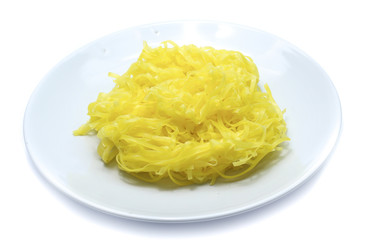 yellow noodles on dish isolated on white background
