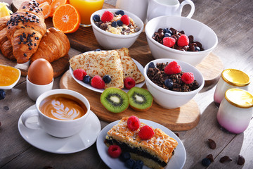 Breakfast served with coffee, juice, croissants and fruits