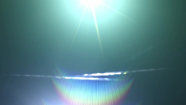 Lens flare light and glow effect over black background. Abstract overlay filter