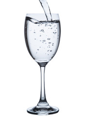 pouring water on a glass on white background clipping path