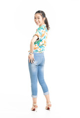 Fototapeta premium Happy cute smiling beautiful young Thai Asian Looking camera showing copy space ,she wears Cloth flowers color happy in Thai ceremony Isolated on white background , success concept