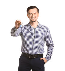Fototapeta premium Male real estate agent with key on white background