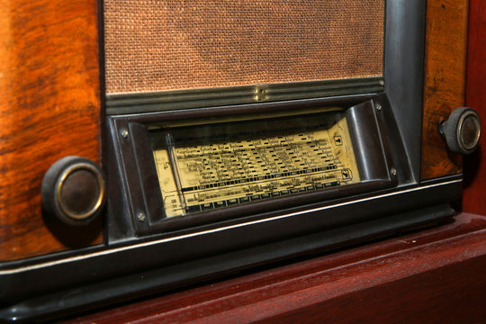 The old retro wooden radio receiver in great condition. The antique design artifact. 
