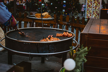 Man interferes with hand meat grilled at sausage festival