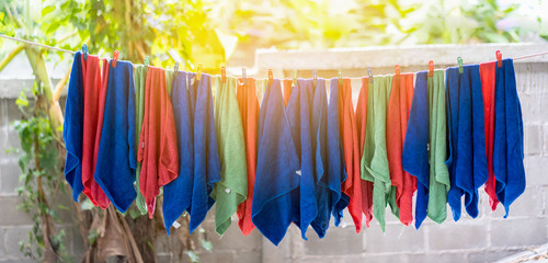 microfiber clothes hanging out to dry, closeup look at fiber structure,for cleaning the car with micro fiber cloth in car care station for banner