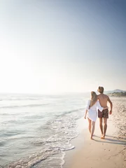 Fototapeten Beautiful couple in love on the beach © ballero