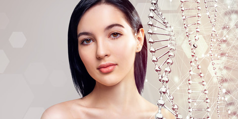 Beautiful sensual woman and glass DNA stems over beige background.