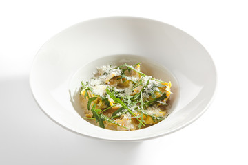 Tortellini with 4 Cheeses on White Restaurant Plate Isolated