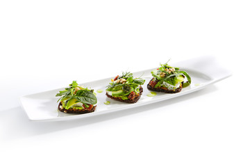 Whole Grain Bread with Vegetables, Cheese, Pesto and Pine Nuts