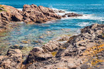 rocky beach with clear water of Atlantic Ocean