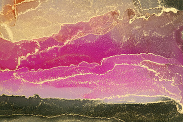 Abstract paint gold and pinkn blots background. Alcohol ink colors. Marble texture.