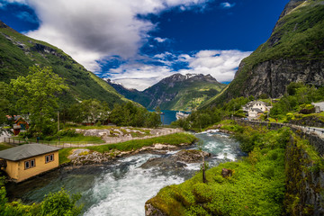 Naklejka na ściany i meble Geiranger fjord, Norway - June,2019: Beautiful Nature Norway 15-kilometre long branch off of the Sunnylvsfjorden, which is a branch off of the Storfjorden