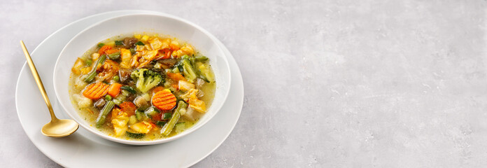 Vegan vegetable soup on light background
