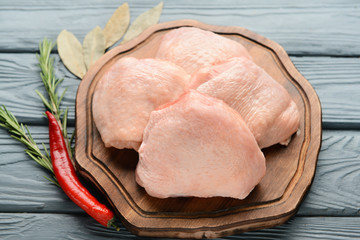 Raw chicken meat on wooden background