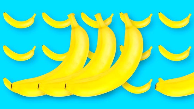 Animated abstract looped video with rotating bananas on a blue high quality 4K background.