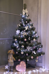 girl decorating christmas tree