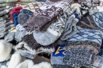 Fototapeta na wymiar handmade, knitted woven socks as a background