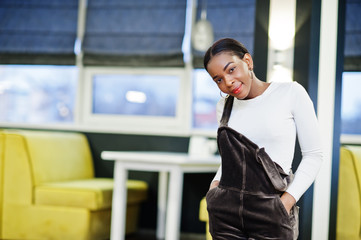 Charming african american woman posing at restaurant.