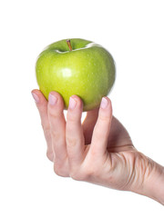 Woman hand holding green apple isolated on white background.
