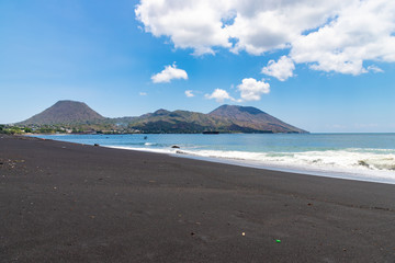 Black sand beach near by the town Ende. Ende, East Nusa Tenggara, Flores, Indonesia.