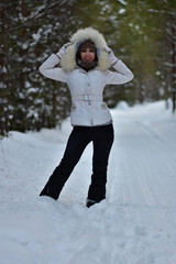 Beautiful girl in the winter January forest