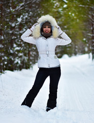 Beautiful girl in the winter January forest