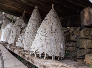 Old ancient beehives on shelf