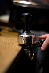 Cappuccino preparation process in coffee shop. Profession barista. The invigorating coffee drink.