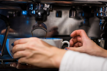 Cappuccino preparation process in coffee shop. Profession barista. The invigorating coffee drink.