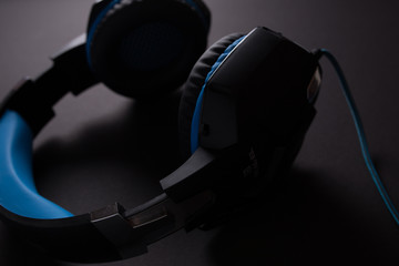 Black headphones on dark background