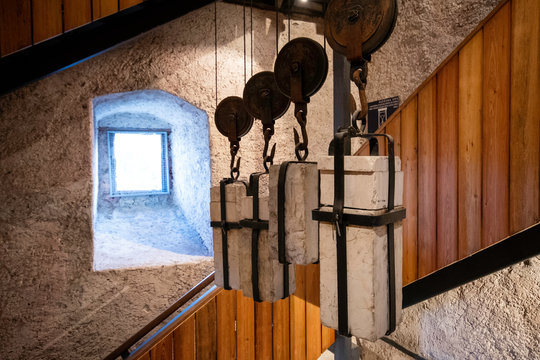 weights, cords and pulleys of a tower clock mecanism