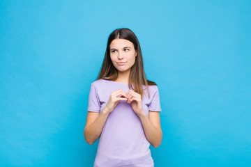 young pretty woman scheming and conspiring, thinking devious tricks and cheats, cunning and...