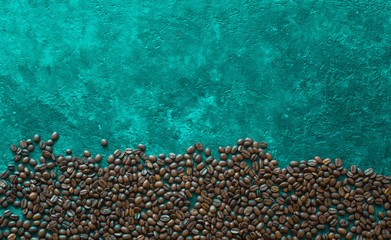 Naklejka na ściany i meble Coffee beans on blue background