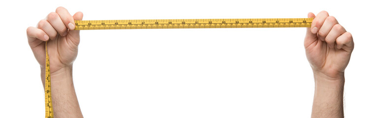 panoramic shot of man holding measuring tape isolated on white