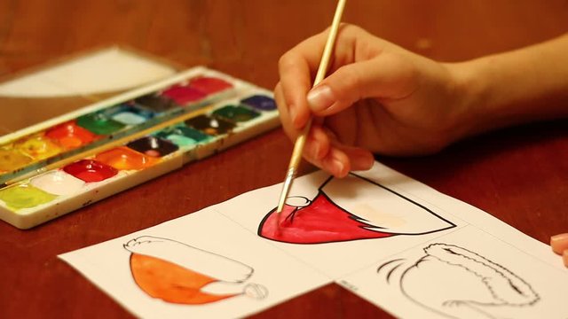 Coloring of Santa Claus hats with watercolor paints
