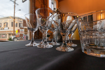 whisky and wine tasting table with stainless steel Martini picks arranged on top of a black cloth in a north Virginia distillery 
