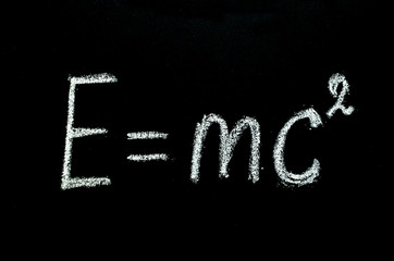 Einstein's formula drawn on chalkboard