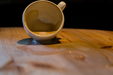 White ceramic a cup of cappuccino with picture spilled, latte art in coffee shop. The morning drink.